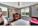 Cozy bedroom featuring hardwood floors, ample natural light, and a calm color scheme at 502 Allen Dr, Lawrenceville, GA 30043