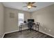 Bedroom with ceiling fan and computer desk setup makes for the perfect work/life balance at 507 Hillcrest Cross Rd, Canton, GA 30115