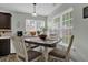 Cozy dining area bathed in natural light from bright windows, ideal for gatherings at 507 Hillcrest Cross Rd, Canton, GA 30115