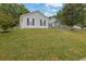 Charming single-story home with light siding, dark shutters, and a well-manicured lawn at 507 Hillcrest Cross Rd, Canton, GA 30115