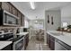 Well-lit kitchen showcasing stainless steel appliances and adjacent breakfast nook with a wooden table at 507 Hillcrest Cross Rd, Canton, GA 30115