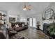 Spacious living room featuring hardwood floors, fireplace, and large french doors at 507 Hillcrest Cross Rd, Canton, GA 30115
