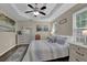 Comfortable bedroom featuring a ceiling fan, neutral walls, and stylish furnishings at 507 Hillcrest Cross Rd, Canton, GA 30115