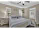 Comfortable bedroom featuring a ceiling fan, neutral walls, and stylish furnishings at 507 Hillcrest Cross Rd, Canton, GA 30115