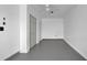 Clean white storage room with gray concrete floors, white walls, closet, and ceiling fan at 507 Hillcrest Cross Rd, Canton, GA 30115