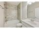 Bright bathroom featuring a shower over tub and a modern sink with vanity at 1036 Grant Park Rd, Decatur, GA 30033