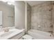 The bathroom features a single sink, tiled floors, and shower over tub at 1036 Grant Park Rd, Decatur, GA 30033