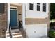 Charming brick exterior with blue door and two-car garage at 1036 Grant Park Rd, Decatur, GA 30033