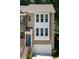 Inviting brick townhome with two-car garage and charming blue door at 1036 Grant Park Rd, Decatur, GA 30033