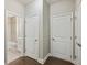 Hallway leading to a bathroom with tiled shower and modern fixtures at 1036 Grant Park Rd, Decatur, GA 30033