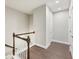 Upstairs hallway with hardwood floors and access to bedrooms at 1036 Grant Park Rd, Decatur, GA 30033