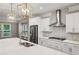Modern kitchen featuring a large island with sink, stainless steel appliances at 1036 Grant Park Rd, Decatur, GA 30033
