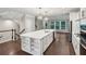 Bright, spacious kitchen featuring a large island, modern appliances, and stylish pendant lighting at 1036 Grant Park Rd, Decatur, GA 30033