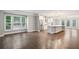 Open concept living space with hardwood floors adjacent to kitchen at 1036 Grant Park Rd, Decatur, GA 30033