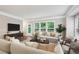 Bright living room featuring large windows, hardwood floors, and neutral color scheme at 1036 Grant Park Rd, Decatur, GA 30033