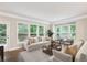 Bright and airy living room with hardwood floors, large windows, and comfortable seating at 1036 Grant Park Rd, Decatur, GA 30033