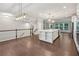 Large kitchen island in open concept with modern fixtures and flooring at 1036 Grant Park Rd, Decatur, GA 30033