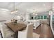 Open kitchen and dining area with modern white cabinets and lighting at 1036 Grant Park Rd, Decatur, GA 30033