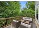 Outdoor patio with seating area surrounded by mature trees at 1036 Grant Park Rd, Decatur, GA 30033