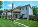 Spacious backyard featuring a charming pergola-covered patio, lush lawn, and an outdoor grilling area for entertaining at 1777 Chasewood Park Ln, Marietta, GA 30066