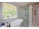 Contemporary bathroom with a freestanding tub, glass shower, and marble-look tile for a spa-like experience at 1777 Chasewood Park Ln, Marietta, GA 30066