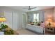 Comfortable bedroom featuring neutral tones, built in closets, and natural light from the window at 1777 Chasewood Park Ln, Marietta, GA 30066