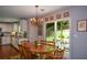 Charming dining room featuring hardwood floors, chandelier, and sliding glass doors to the outdoor patio at 1777 Chasewood Park Ln, Marietta, GA 30066