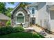 Charming front porch with stone accents and a cozy seating area with rocking chairs at 1777 Chasewood Park Ln, Marietta, GA 30066