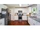Modern kitchen with white cabinets, stainless steel appliances, and granite countertops at 1777 Chasewood Park Ln, Marietta, GA 30066