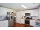 Modern kitchen with white cabinets, stainless steel appliances, and granite countertops at 1777 Chasewood Park Ln, Marietta, GA 30066