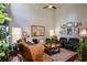 Cozy living room showcasing high ceilings, a ceiling fan, comfortable seating, and natural light at 1777 Chasewood Park Ln, Marietta, GA 30066