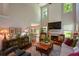 Elegant living room with high ceilings, a fireplace, and a view into the dining area at 1777 Chasewood Park Ln, Marietta, GA 30066