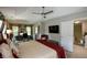 Large main bedroom offering a ceiling fan, tray ceilings, a flatscreen tv, and comfortable furnishings at 1777 Chasewood Park Ln, Marietta, GA 30066