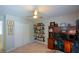 Bright office with a ceiling fan, built-in bookshelves, desk, and a large closet at 1777 Chasewood Park Ln, Marietta, GA 30066