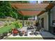 Shaded patio featuring a pergola, outdoor seating, and potted plants, perfect for relaxing outdoors at 1777 Chasewood Park Ln, Marietta, GA 30066