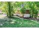 Back of brick home surrounded by mature trees at 2201 Bollingbrook Drive, Atlanta, GA 30311