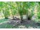 The home's backyard is surrounded by beautiful mature trees providing ample shade at 2201 Bollingbrook Drive, Atlanta, GA 30311