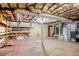 Unfinished basement with exposed ceiling and shelves at 2201 Bollingbrook Drive, Atlanta, GA 30311