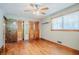 Bedroom with hardwood floors, ceiling fan, windows, and closets at 2201 Bollingbrook Drive, Atlanta, GA 30311