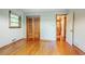 Bedroom with hardwood floors, window, and closets at 2201 Bollingbrook Drive, Atlanta, GA 30311