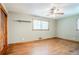 Bedroom with hardwood floors, ceiling fan, windows, and closet at 2201 Bollingbrook Drive, Atlanta, GA 30311