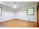 A bedroom with hardwood floors and two windows at 2201 Bollingbrook Drive, Atlanta, GA 30311
