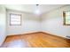 A bedroom with hardwood floors and two windows at 2201 Bollingbrook Drive, Atlanta, GA 30311