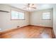 Bedroom with hardwood floors, two windows, and ceiling fan at 2201 Bollingbrook Drive, Atlanta, GA 30311