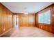 Wood-paneled dining room filled with natural light, providing a warm and inviting space for Gathering meals at 2201 Bollingbrook Drive, Atlanta, GA 30311