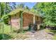 Charming brick home with steps leading to the front door and mature landscaping at 2201 Bollingbrook Drive, Atlanta, GA 30311