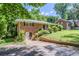 Charming brick ranch home with a basement entrance, set back from the street on a grassy lot at 2201 Bollingbrook Drive, Atlanta, GA 30311