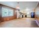 Spacious eat-in kitchen features wood-paneled walls, laminate flooring, and ample storage with white cabinetry at 2201 Bollingbrook Drive, Atlanta, GA 30311