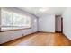 Bright living room features hardwood floors, a large window, and freshly painted walls, offering versatile layout options at 2201 Bollingbrook Drive, Atlanta, GA 30311