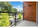 This balcony features a metal railing and views of the neighborhood at 367 Parkway Ne Dr # 4, Atlanta, GA 30312